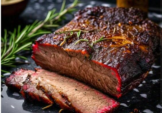 Smoked brisket with rosemary on dark surface.