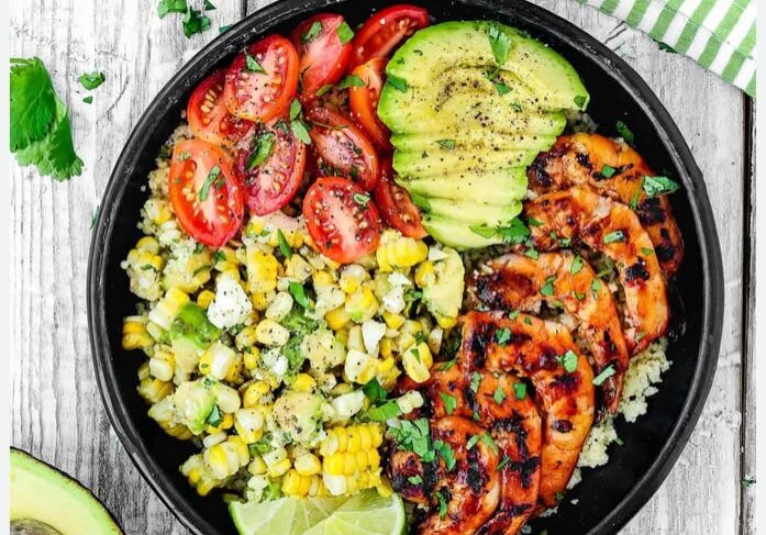 Grilled chicken bowl with avocado and veggies.