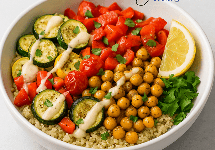Quinoa bowl with vegetables and lemon slice.